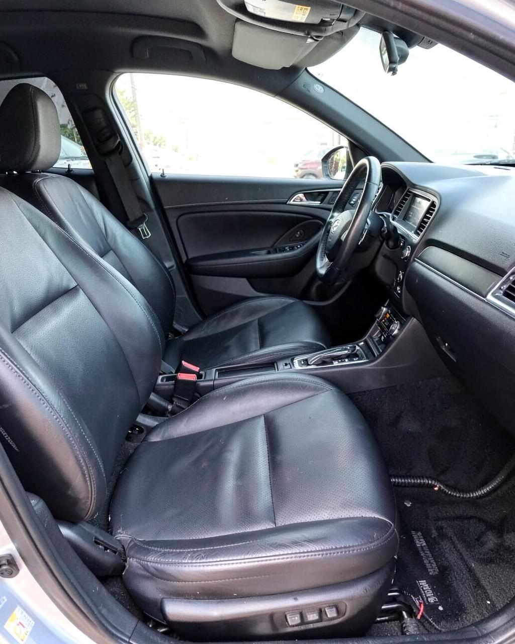 Spotless detailed car interior with clean leather seats